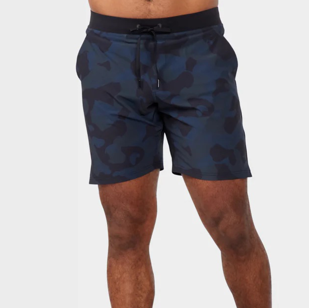 Man wearing blue and black printed workout shorts.